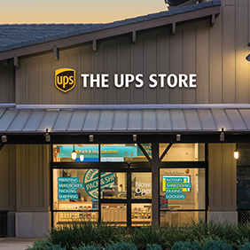 The front of a The UPS Store front stand alone building