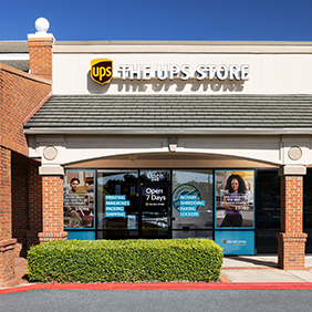 The front of a The UPS Store front in a strip mall