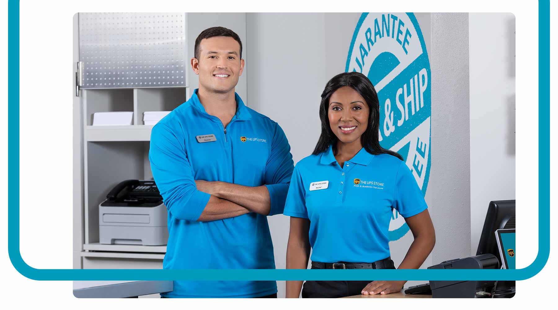 A male and female coworker in UPS store uniforms looking professional.