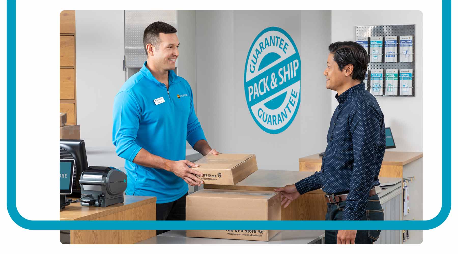 A The UPS Store employee helping a customer with packaged boxes