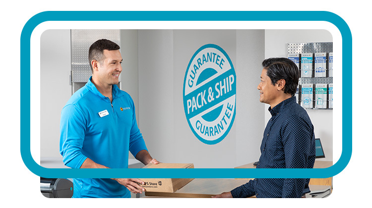 A The UPS Store employee helping a customer with packaged boxes
